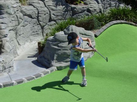 Playing mini-golf at the beach